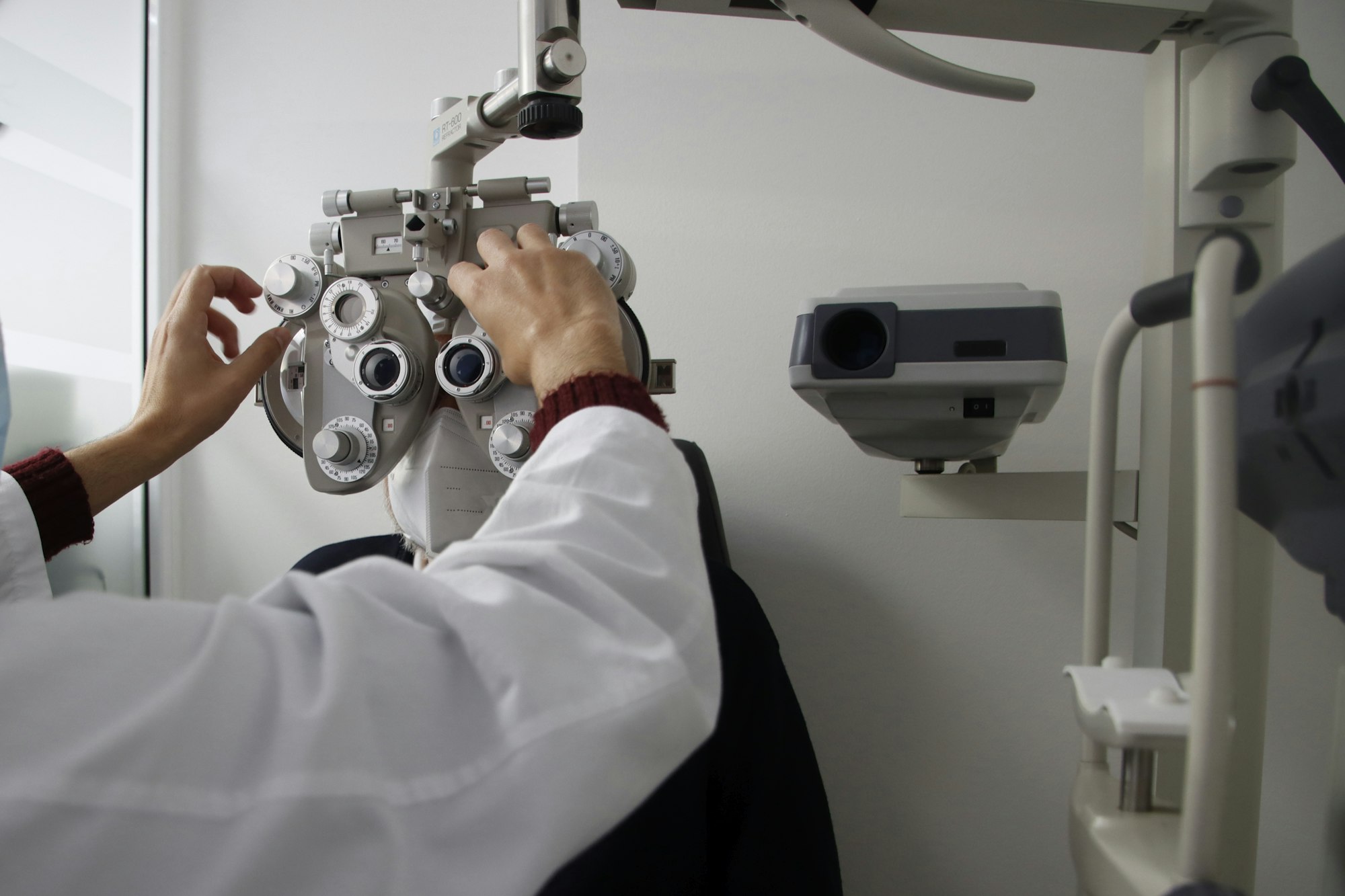 Medical professional using a camera to examine screen data